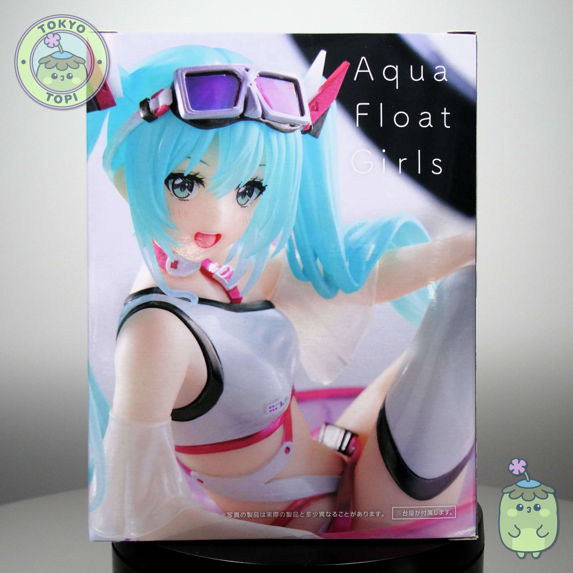 This Taito-crafted collectible features Hatsune Miku rendered in aquatic attire, positioned on a floating ring with integrated water base display stand. Standing approximately 10cm tall, the figure introduces dynamic visual interest and dimensional variety to any collection. An ideal acquisition for enthusiasts seeking distinctive character representations with premium manufacturing quality.