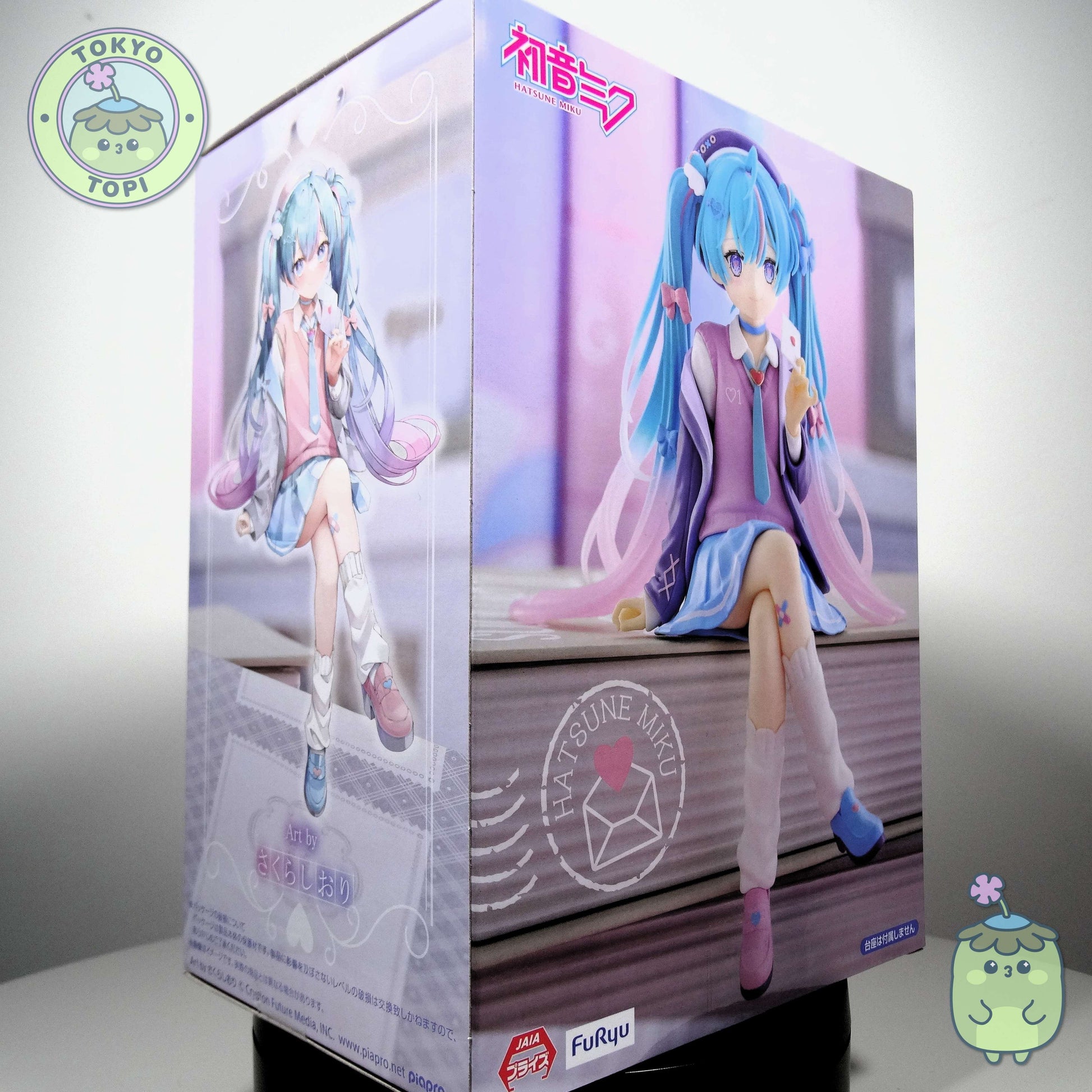 This charming Noodle Stopper captures Hatsune Miku in her iconic Blazer in Love Navy outfit. Standing approximately 14cm tall, the figure showcases meticulous craftsmanship with carefully rendered details across her distinctive hair and delicate leg tattoo. The pink and blue colour palette perfectly complements the character's signature aesthetic, making it an essential addition for devoted collectors and fans of the beloved virtual idol.