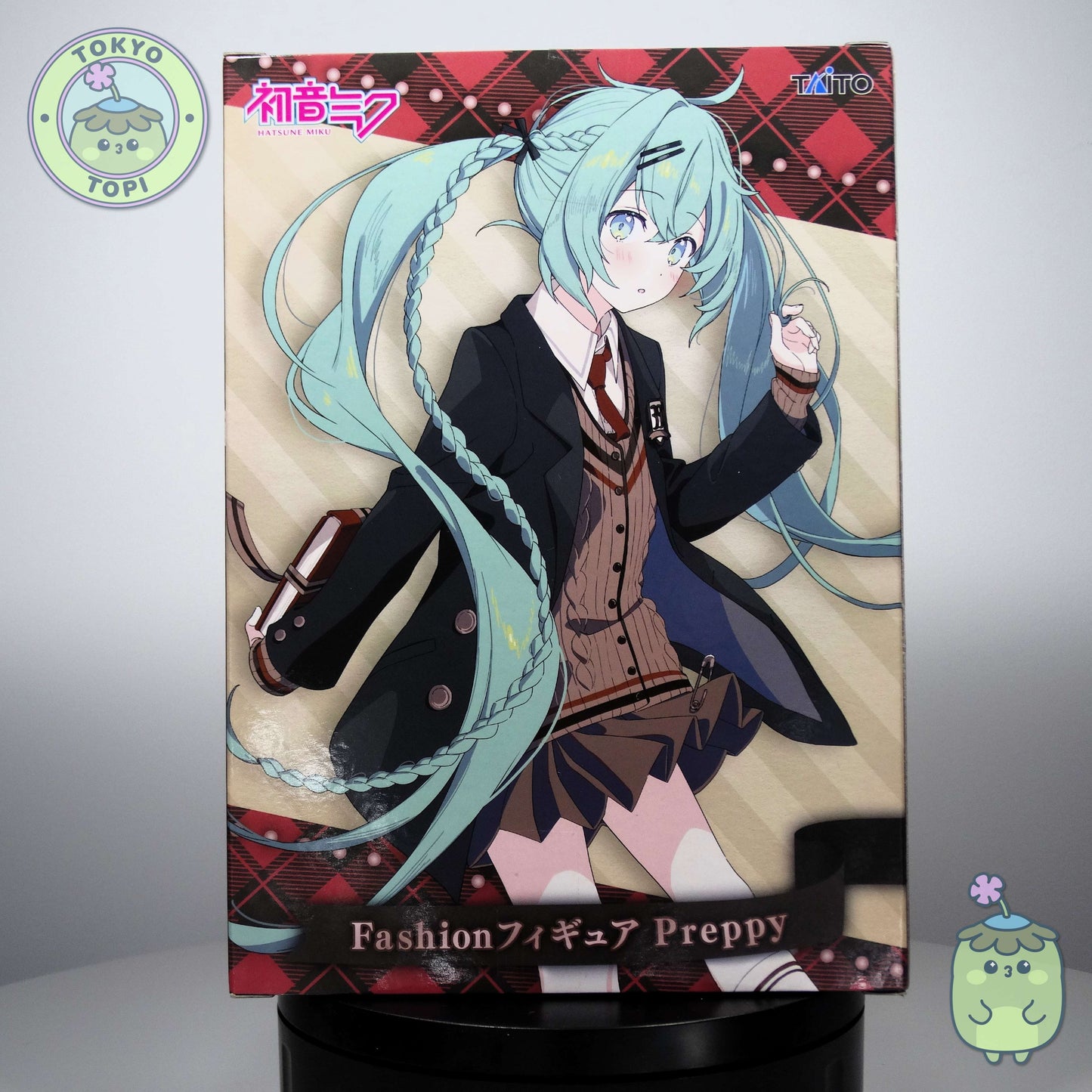 Taito's meticulously crafted Miku collectible captures the beloved Vocaloid icon in charming preppy style. Standing approximately 18cm tall, this figure appeals to both seasoned collectors and newcomers seeking quality character merchandise. The attention to detail makes it an excellent addition to any anime or gaming collection.
