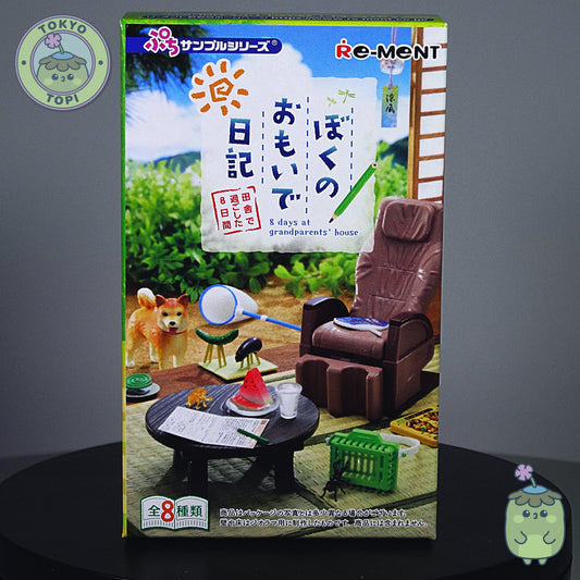 Re-Ment miniature packaging with a scene of a dog, table, and chair on a gray background.