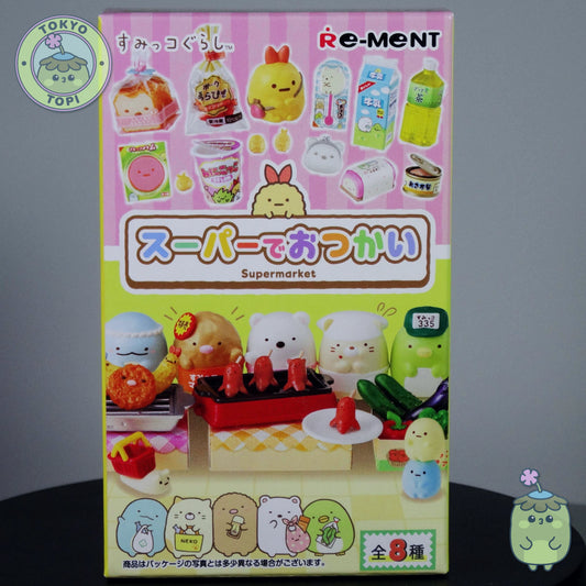 Re-Ment miniature toy set packaging with cartoon characters on a pink and yellow background.