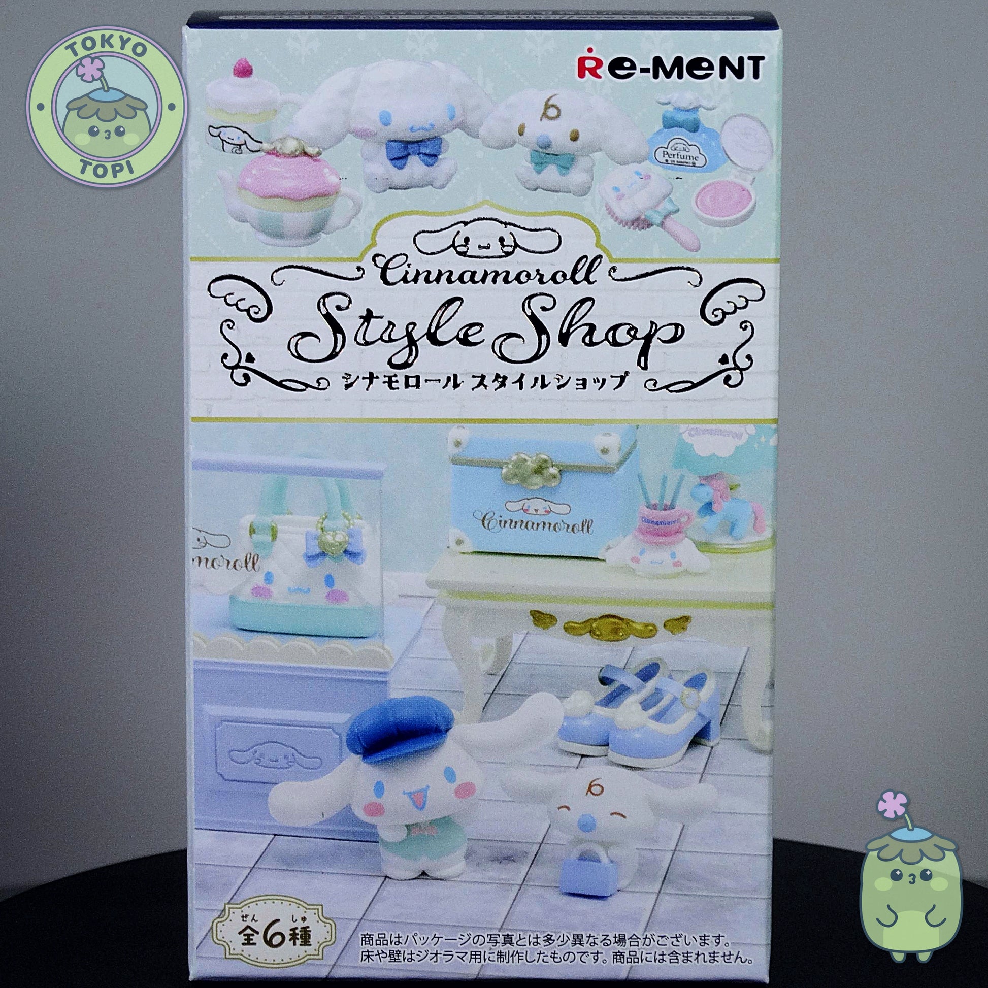 Box of Re-Ment Cinnamoroll Style Shop with toy figures on a gray background