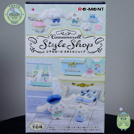 Box of Re-Ment Cinnamoroll Style Shop with toy figures on a gray background