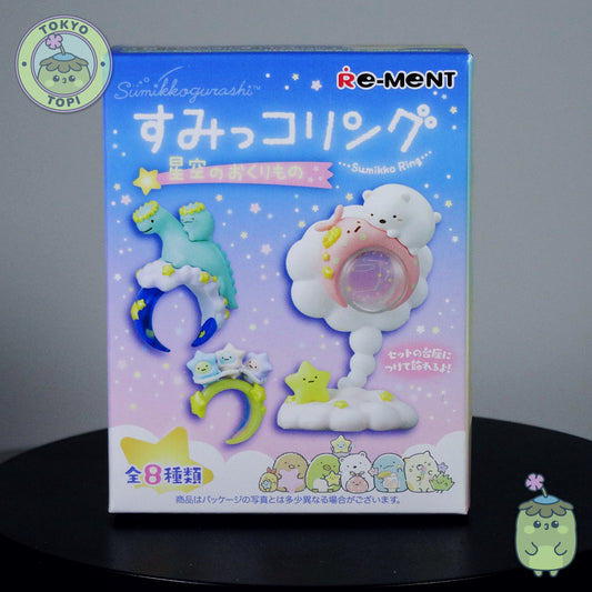 Re-ment miniature packaging with cartoon characters on a dark surface