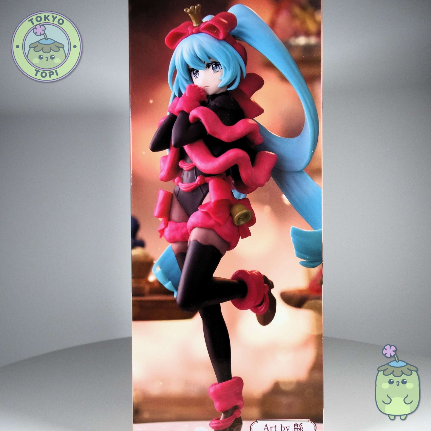 This festive Hatsune Miku figure showcases the beloved character in an uncommon darker palette, crafted by Furyu's SweetSweets Noel Raspberry collection. Standing approximately 21cm tall, the figure arrives with an innovative creative stand designed to resemble a decorative plate, adding visual interest to any display. Perfect for collectors seeking a distinctive seasonal interpretation of this iconic character.